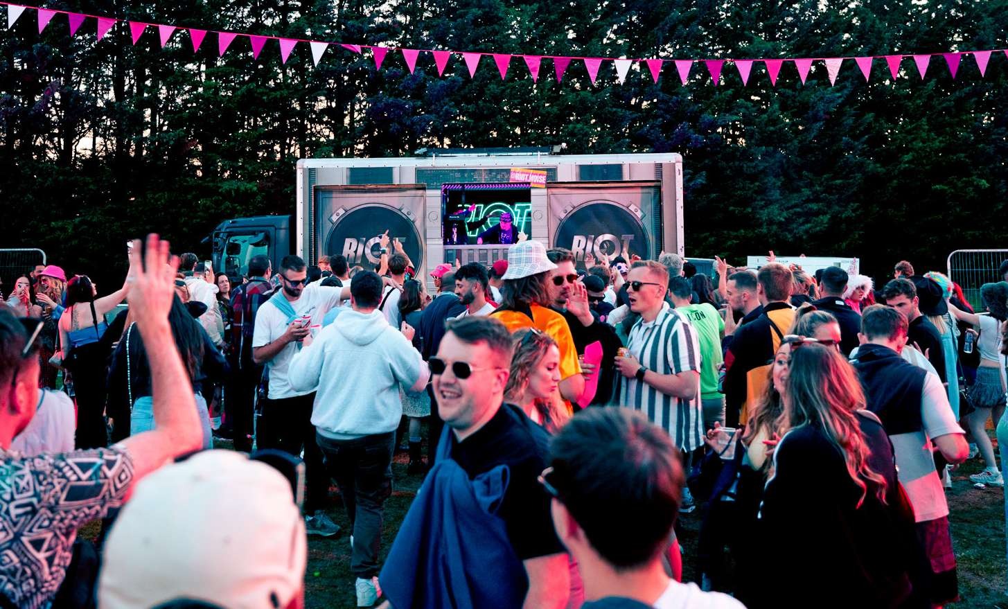 Truck at festival with bunting and crowd